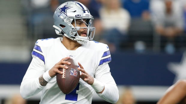 Dak Prescott prepares to throw a pass during a game against the Falcons in 2021